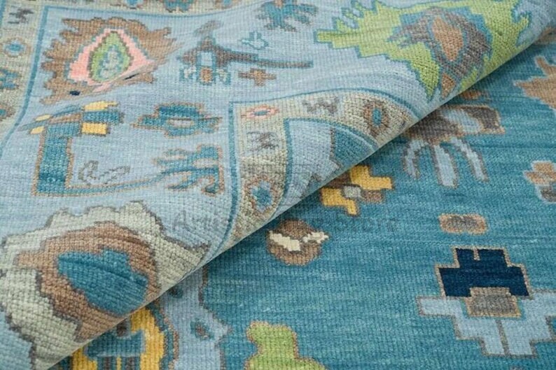 a close up of a rug with a blue background