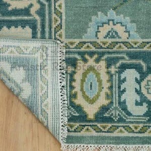 a rug with a wooden floor next to it