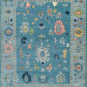 a blue rug with many different designs on it