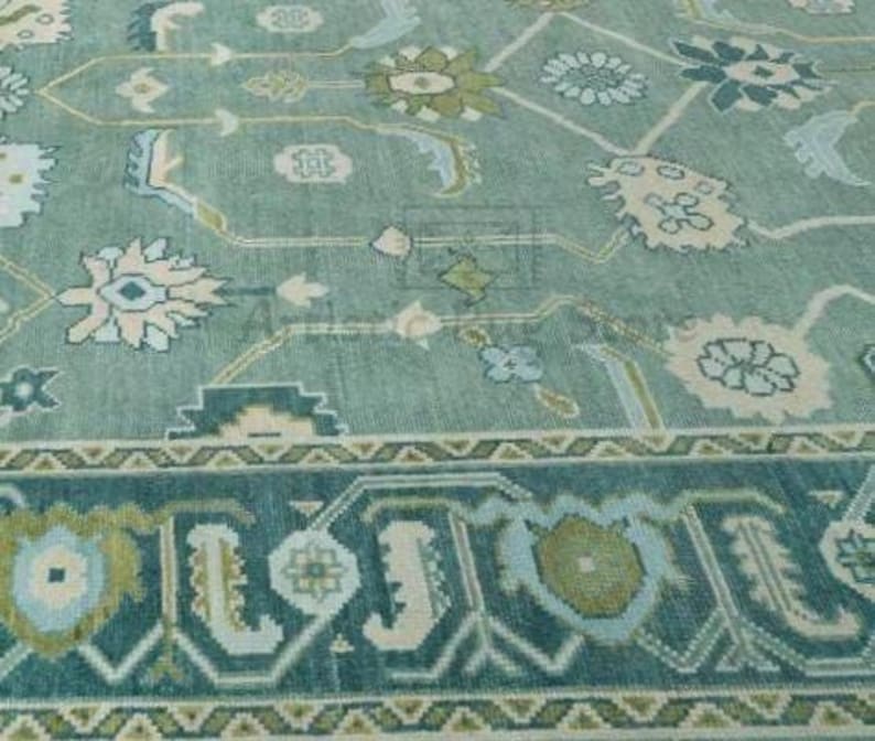 a blue and green rug with a pattern on it
