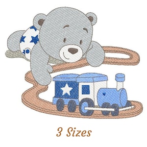 May include: A grey teddy bear wearing a blue and white star patterned nappy is playing with a blue and white toy train on a brown wooden track. The train has a blue engine and a white carriage with a star on it. The text "3 Sizes" is below the image.