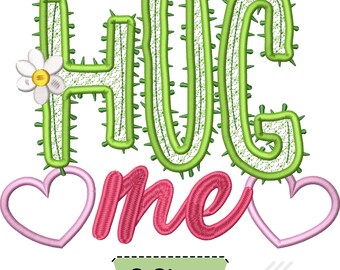 May include: An embroidery design featuring the text HUG me in green cactus-shaped letters with small spikes and a white flower with a yellow center on the H. Two light pink heart outlines flank the word me, and a label reads 8 Sizes below.
