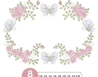 May include: An embroidery design featuring a floral wreath of pink roses and green leaves accented by three light blue butterflies. The text 8 Sizes 10, 12, 14, 16, 18, 19, 22, 25 CM is displayed in a pink circle and a dashed rectangular box.