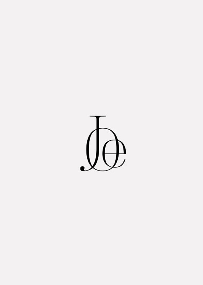 May include: A monogram logo with the letters "J" and "E" intertwined.