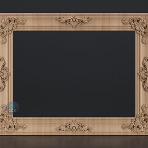 May include: A large, ornate wooden picture frame with intricate carvings. The frame is light brown in color and has a rectangular shape.