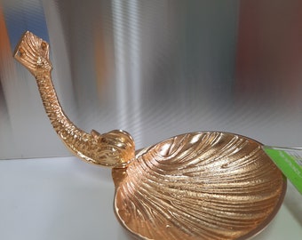 Brass bathroom accessories: fish-shaped toilet paper, soap, and cup holder