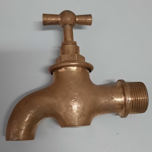Old faucet. Brass faucet for water. Retro plumbing image 1