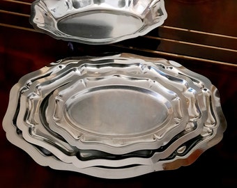 Large oval French vintage tray with stylized scalloped stainless steel edge. Large stainless steel dish in retro style.