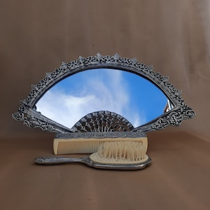 Antique brass mirror and two vintage combs. Antique set - table mirror and combs. Portuguese vintage. Mirror in the form of a fan.