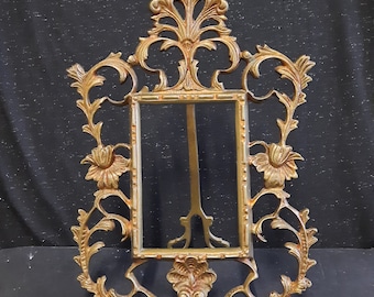 Bronze vintage photo frame. Brass candlestick for two candles. Bronze bell.