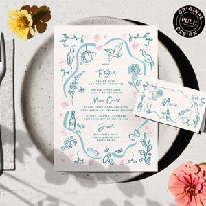 Könnte beinhalten: Eine Menü- und Tischkarte mit floralem Design. Das Menü hat einen hellblauen Rand mit Illustrationen von Blumen, Vögeln und einer Discokugel. Die Gerichte umfassen Caesar-Salat, Seeteufel und Eton Mess. Die Tischkarte trägt die Aufschrift "Maria".