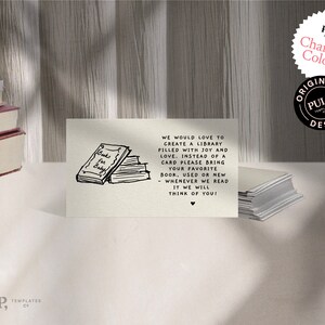 May include: A white card with black text that reads "We would love to create a library filled with joy and love. Instead of a card please bring your favorite book, used or new. Whenever we read it we will think of you!"  A black and white illustration of a stack of books with the text "Books for Baby" on the top book is on the left side of the card.
