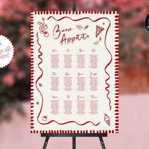Pode incluir: Um cartão de lugar branco com listras vermelhas e uma borda vermelha. O cartão é intitulado "Buon Appetito" e apresenta ilustrações de uma fatia de pizza, tomates e um cone de sorvete. O cartão lista os nomes das mesas e os nomes dos convidados.