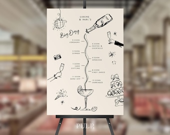 May include: A cream-coloured wedding day timeline sign with black ink illustrations. The sign includes the text "CORINE & KARL'S Big Day" and a schedule with times for the ceremony, dinner, cake cutting, and first dance. The sign is displayed on a black easel.