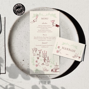 Könnte beinhalten: Eine Hochzeitsmenü- und Tischkarte mit floralem Design. Das Menü hat eine handschriftliche Schriftart mit dem Wort "MENU" oben. Auf der Tischkarte steht der Name "HANNAH". Besteck und ein Teller sind ebenfalls sichtbar.
