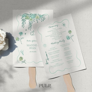 May include: Two white wedding fan programs with teal floral illustrations and text. One fan reads "Order of Orders" with names and a date. The other fan lists the ceremony and wedding party details.