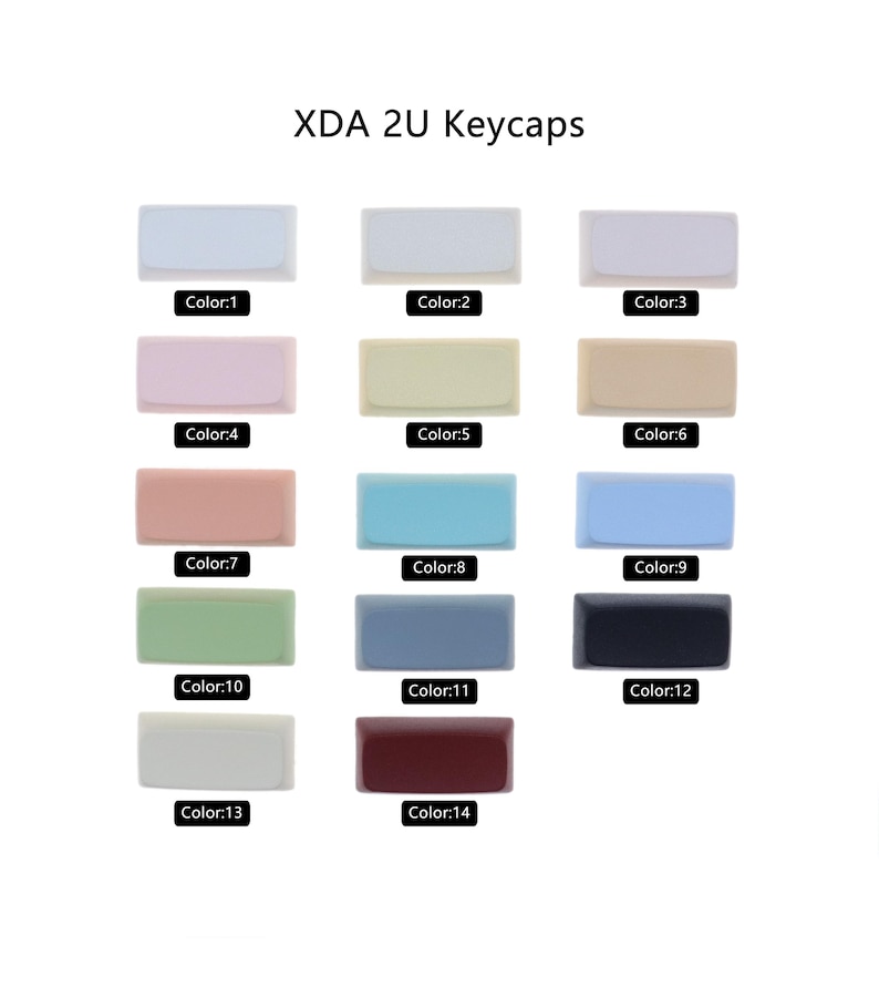 Puede incluir: Un conjunto de 14 teclas XDA 2U en varios colores, incluyendo blanco, beige, rosa, azul, verde, gris, negro y rojo. Las teclas est&aacute;n dispuestas en filas de tres, con cada fila etiquetada con un n&uacute;mero de color.