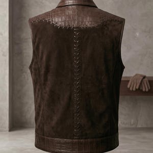 Back view of a premium leather gear waistcoat highlighting the crocodile leather yoke, thick hand-stitched detailing, and tailored alligator texture bottom hem.