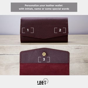 a burgundy leather wallet with initials and some special words printed on it, allowing for personalization.