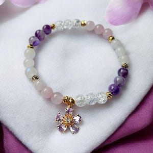 Gemstone bracelet with zircon flower pendant