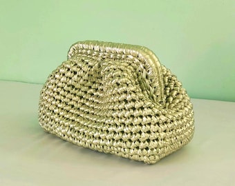 Light gold woven clutch bag with soft structured handle