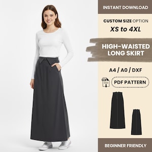 Op de afbeelding: Een vrouw draagt een wit shirt met lange mouwen en een hoog getailleerde, donkergrijze lange rok. De afbeelding bevat tekst: "DIRECT DOWNLOADEN", "AANGEPASTE MAAT OPTIE XS tot 4XL", "HOGE TAILLE LANGE ROK", "A4/A0/DXF", "PDF PATROON" en "BEGINNER VRIENDELIJK".