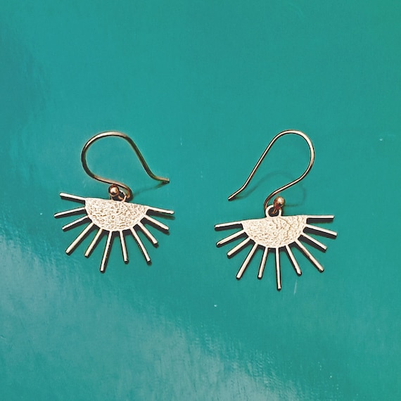 Half sun best sale earrings