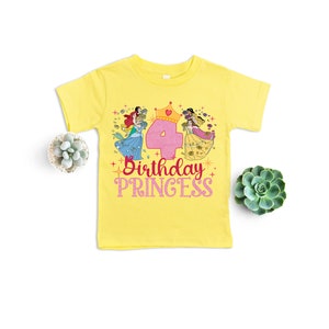 May include: Yellow t-shirt with a pink number four and a graphic of Disney princesses. The text "Birthday Princess" is printed on the shirt.