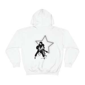 May include: White hooded sweatshirt with a black and white graphic of a person playing a guitar in front of a star.