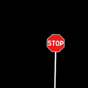May include: A red octagonal stop sign with white lettering against a black background. The sign reads "STOP".
