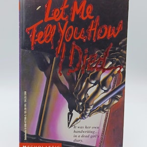May include: A paperback book titled "Let Me Tell You How I Died" by Sinclair Smith. The cover features a skeleton hand writing in a diary, with red lettering and the Scholastic logo.