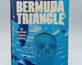 May include: A vintage paperback book titled "The Bermuda Triangle" by Adi-Kent Thomas Jeffrey. The cover is blue with white text and a map of the Bermuda Triangle. The book promises a fold-out map and photographs.