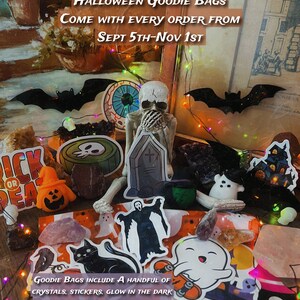 May include: A Halloween goodie bag filled with various spooky and colorful items, including crystals, stickers, glow-in-the-dark skulls, a squishy, and a Halloween decoration. The bag is decorated with a festive Halloween pattern and includes the text "Halloween Goodie Bags Come with Every Order From Sept 5th-Nov 1st".