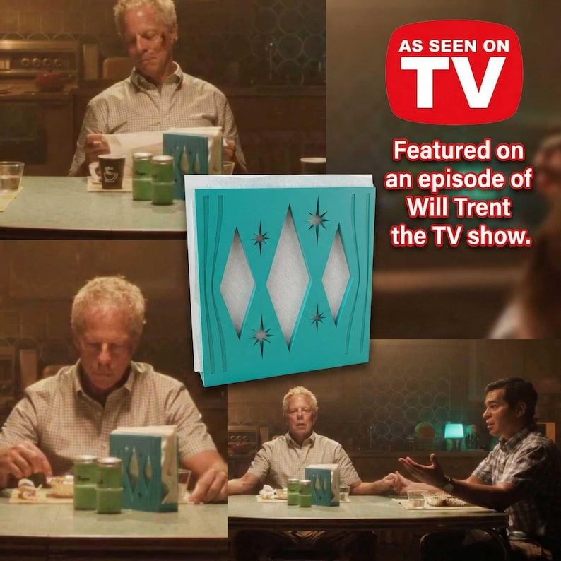 May include: A square teal napkin holder featuring a cutout pattern of three vertical diamonds and starburst shapes. The holder contains white paper napkins and is displayed alongside text stating AS SEEN ON TV and Featured on Will Trent.