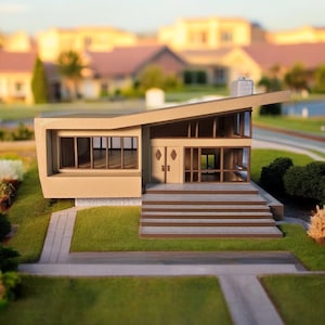 May include: A beige model home with a modern design, featuring a flat roof with a sharp angle, large windows, and a set of stairs leading to the front door.