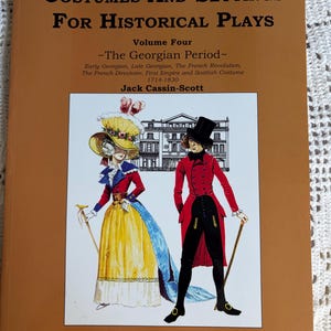 May include: A book titled "Costumes and Settings for Historical Plays" with a brown cover. The cover features an illustration of two figures in Georgian-era attire. The book is Volume Four, focusing on the Georgian Period from 1714-1830.