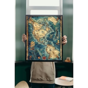 May include: A framed vintage style map of North America with a blue and brown color scheme. The map features a compass, ships, and sea monsters. The text on the map includes 'MERI', 'GRAMA', 'MANITO', and 'NORTH AMERICA'.