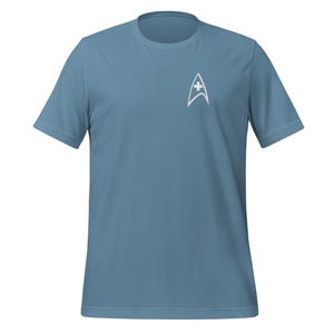 May include: A blue t-shirt with a white Starfleet insignia on the left chest.