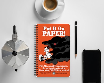 Cuaderno espiral de propaganda de guerra de los Cylon: "Ponlo en papel"