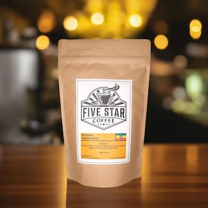 May include: A brown paper bag with a label that says "Five Star Coffee" and features a coffee cup with steam rising from it. The label also says "Ethiopia Yirgacheffe" and lists the coffee's flavor notes, roast level, and origin.