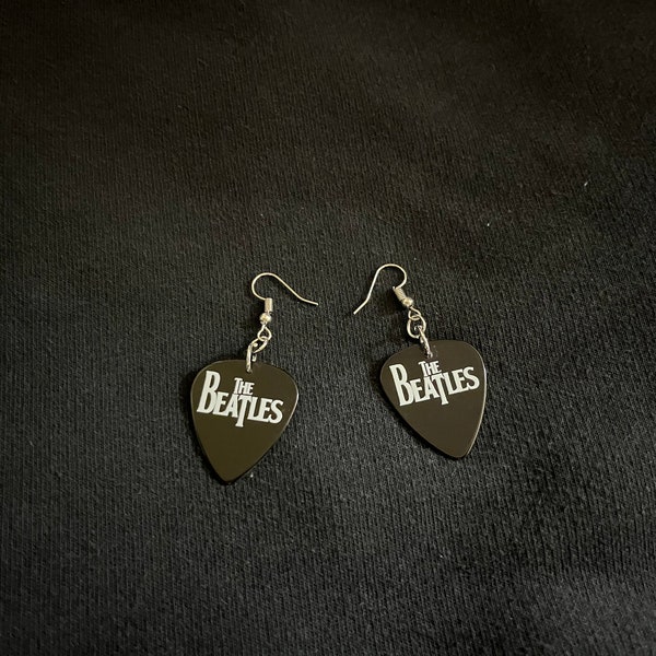 Beatles guitar pic earrings, dangly.