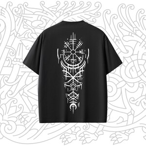 May include: Black t-shirt with a white design of a compass and other symbols on the back.