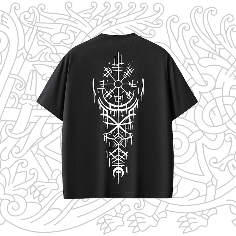 May include: Black t-shirt with a white design of a compass and other symbols on the back.