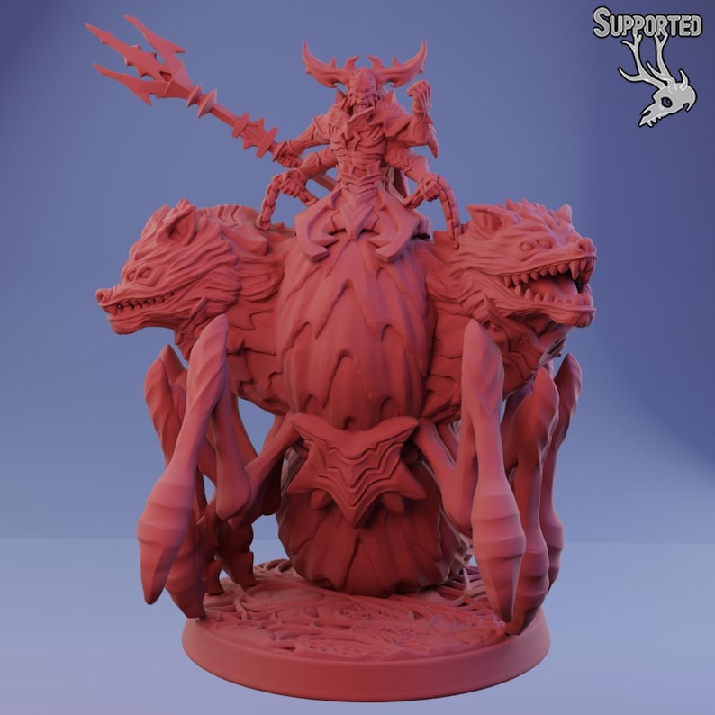 May include: A red fantasy miniature of a multi-limbed demon riding a three-headed beast. The demon holds a spear, and the beast has sharp teeth and claws. The miniature is on a round base, likely for tabletop gaming.