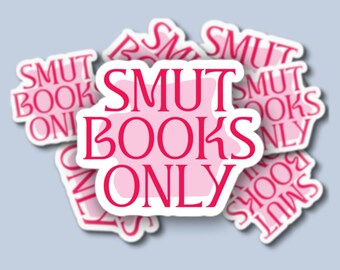 May include: A pink and white sticker with the text "SMUT BOOKS ONLY" in red lettering. The sticker is surrounded by other stickers with the same text.