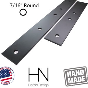 May include: Two black metal shelf brackets with 7/16" round holes. The brackets are handmade and have a "HN" logo with "HarNa Design" text below. The brackets are made in the USA.