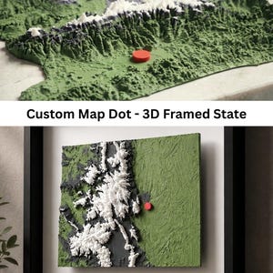 May include: A 3D topographic map featuring white mountain peaks, dark gray slopes, and green lowlands, accented by a single red circular marker. The text Custom Map Dot - 3D Framed State appears above a framed version of the textured relief map.