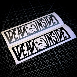 May include: Two black and white stickers with the text "Dead Inside" and a ghost illustration.