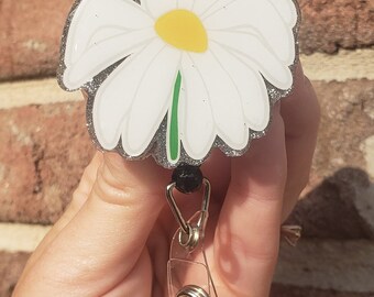 Wilted lilly flower badge reel