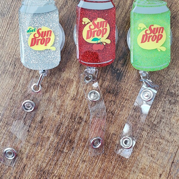 Soda can Sundrop badge reel